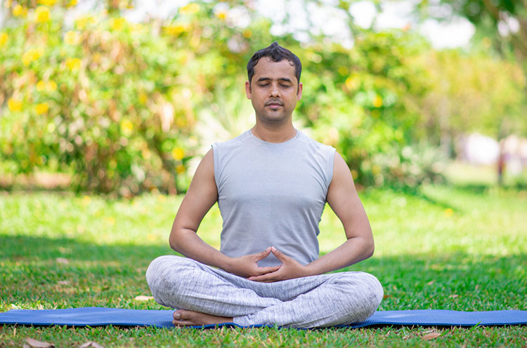 A man is doing Lotus Pose - Emoha