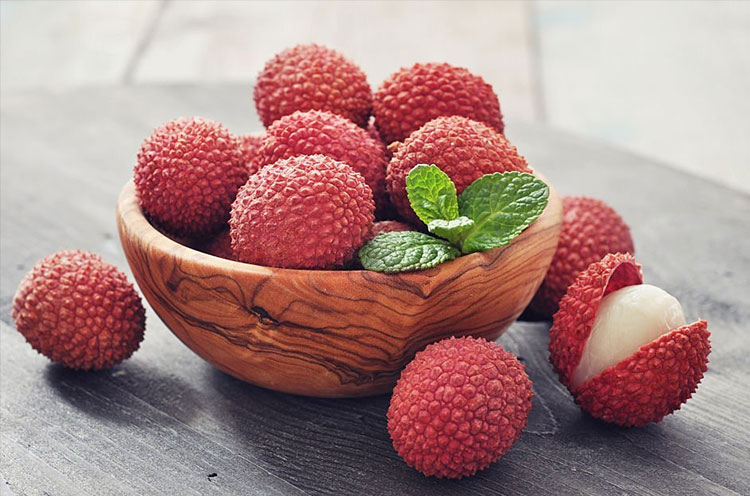 Lychees kept in a bowl - Emoha