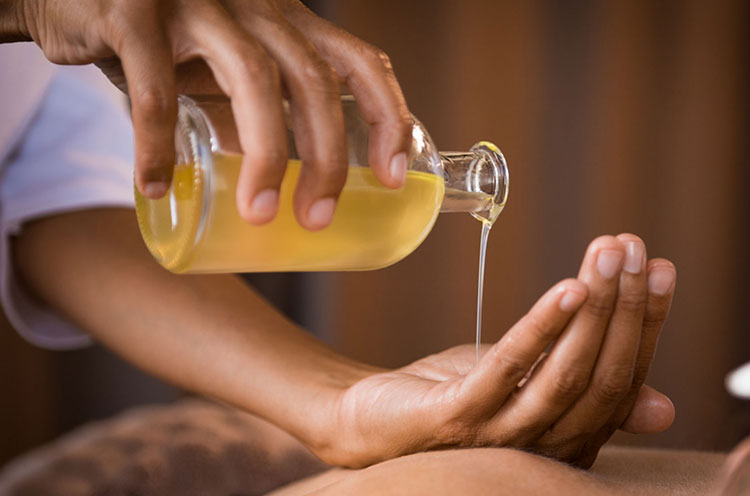 Oil pouring on palm - Emoha