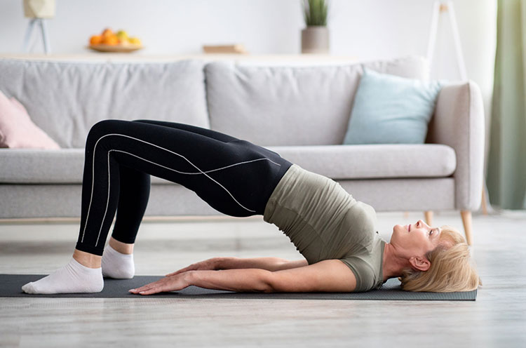 Woman doing Bridge pose - Emoha
